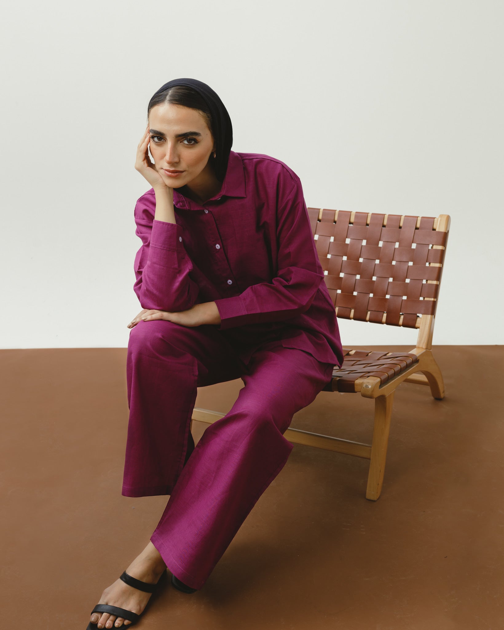 Model wearing women's burgundy linen pants from Chocka Egypt