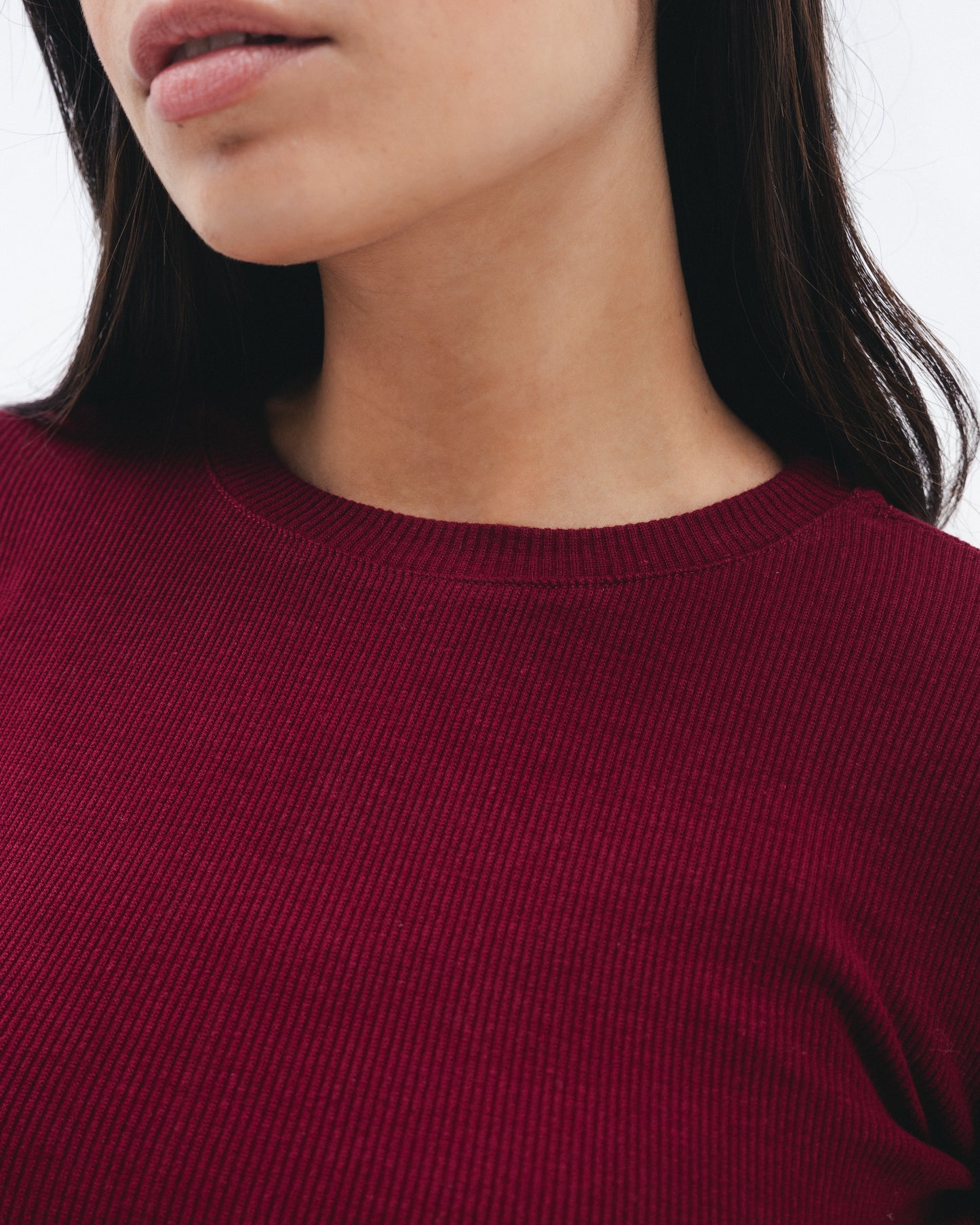 Model wearing women's ruby ribbed long sleeve top from Chocka Egypt