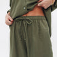 Model wearing women's olive linen pants from Chocka Egypt